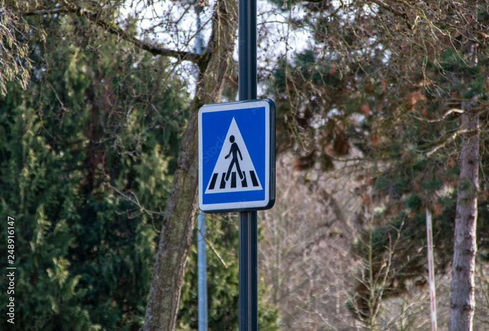 traffic sign, pedestrian crossing, mounted on a pole traffic sign, pedestrian crossing, mounted on a pole