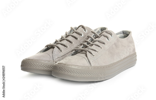 Pair of stylish sneakers on white background