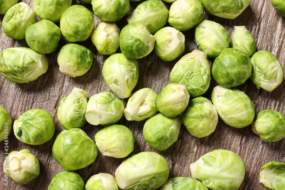 Fresh Brussels sprouts on wooden table, top view Fresh Brussels sprouts on wooden table, top view