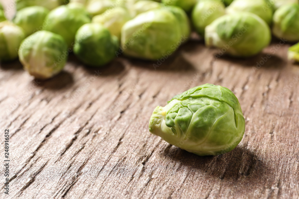 Fresh Brussels sprouts on wooden table, closeup. Space for text Fresh Brussels sprouts on wooden table, closeup. Space for text