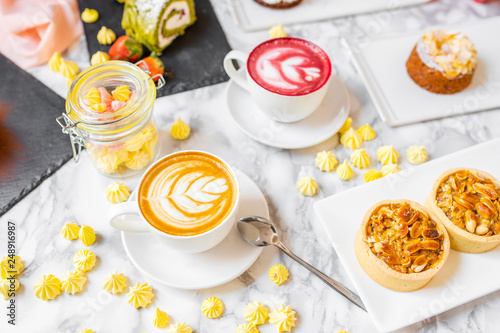 delicious composition of latte tea with cakes