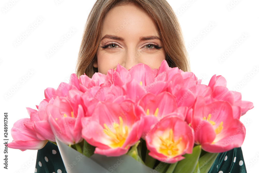 Young girl with beautiful tulips on white background. International Women's Day