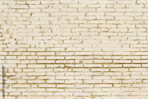 Old beige brick wall background texture