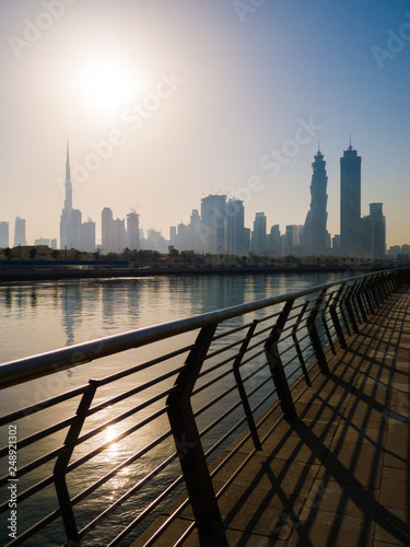 Panorama of the city of Dubai early in the morning at sunrise with a bridge over the city channel Dubai Greek. photo