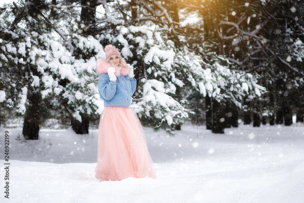 portrait of a beautiful girl on a walk in the winter forest. portrait of a beautiful girl on a walk in the winter forest.