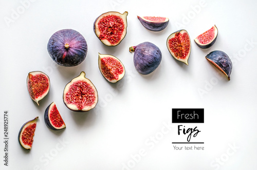 Fresh figs.Food Photo. Creative diagram of a whole and sliced ​​figs on a white background with space for text. View from above. Copy space photo