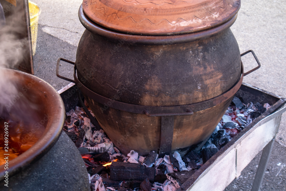 Preparing food outdoor for many people, direct on fire in a big pot. Preparing food outdoor for many people, direct on fire in a big pot.