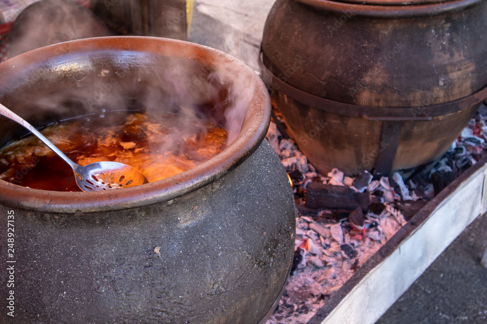 Preparing food outdoor for many people, direct on fire in a big pot. Preparing food outdoor for many people, direct on fire in a big pot.