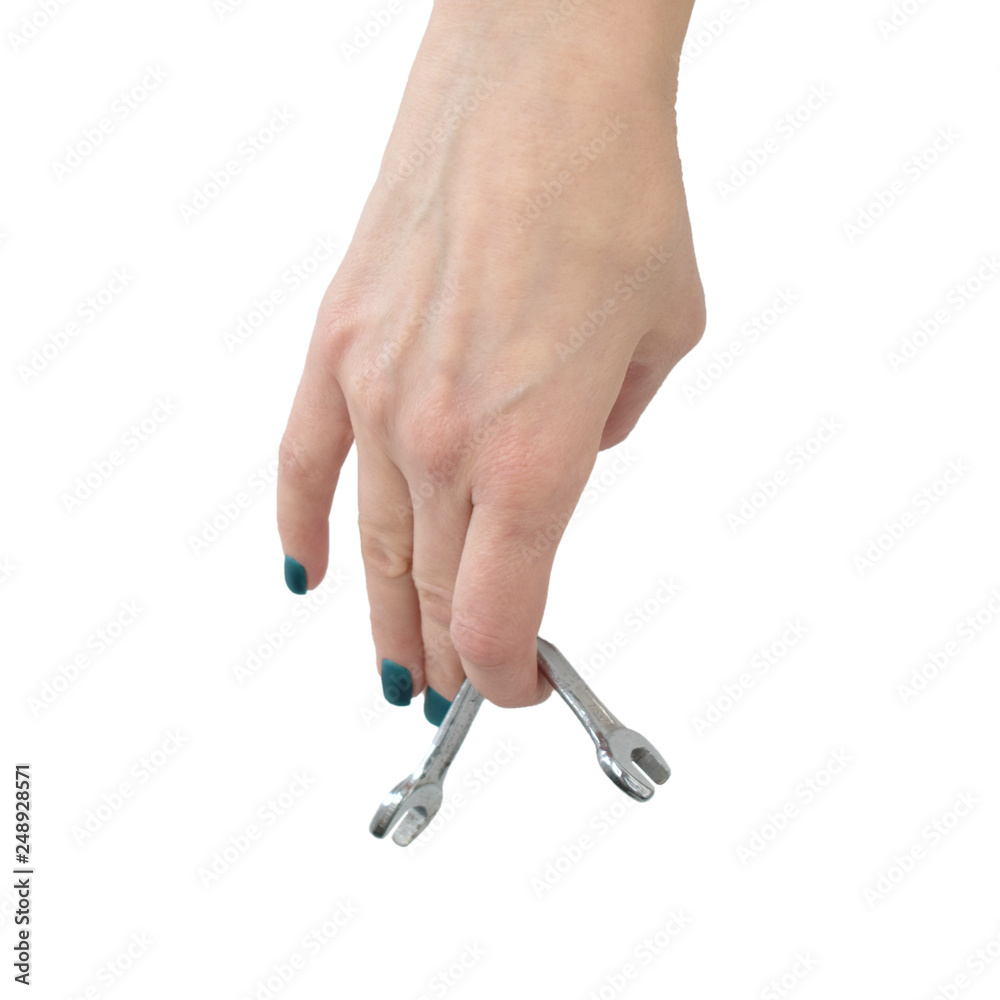 female hand holding a bent spanner, isolate female hand holding a bent spanner, isolate