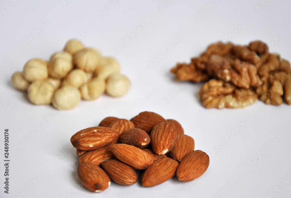 heap of mixed nuts isolated on white background heap of mixed nuts isolated on white background