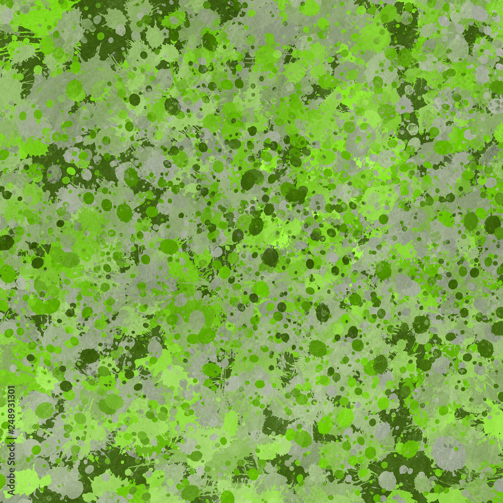 Green paint splatter effect texture on gray paper background. Artistic backdrop. Different paint drops. 