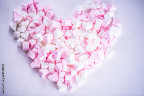 Pink and white marshmallow candies in form of hearts © Julija