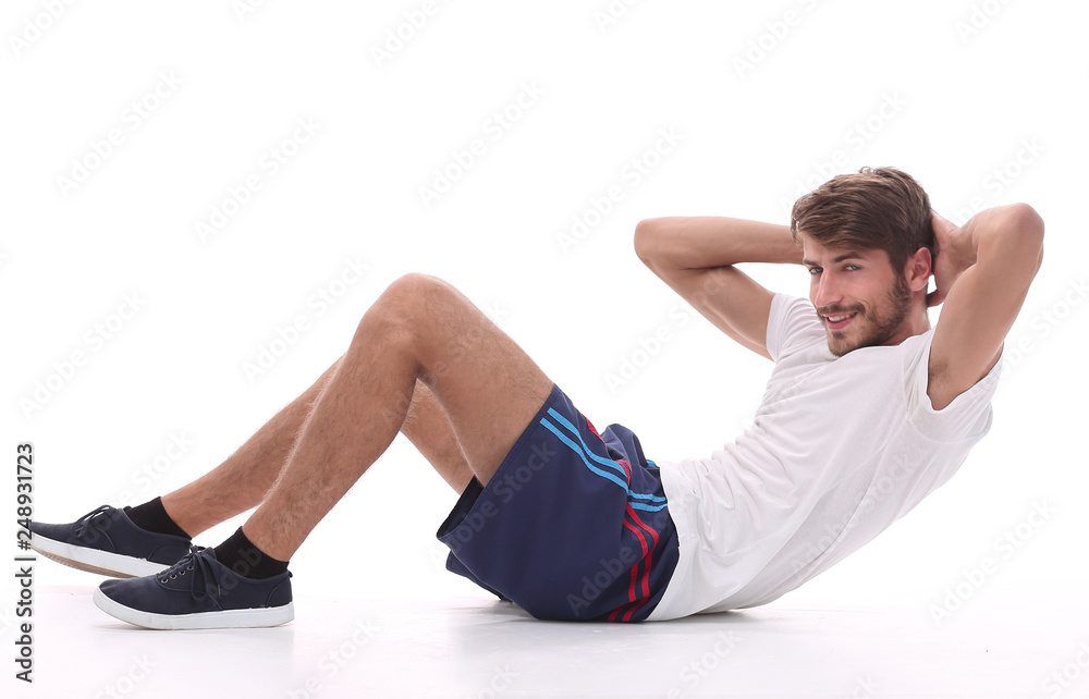 young man performs physical exercise young man performs physical exercise