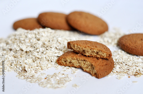 oatmeal cookies and oats on white background