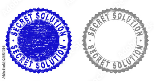 Grunge SECRET SOLUTION stamp seals isolated on a white background. Rosette seals with distress texture in blue and grey colors. Vector rubber stamp imprint of SECRET SOLUTION tag inside round rosette.