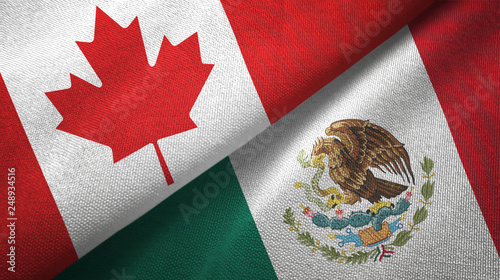 Canada and Mexico two flags textile cloth, fabric texture photo