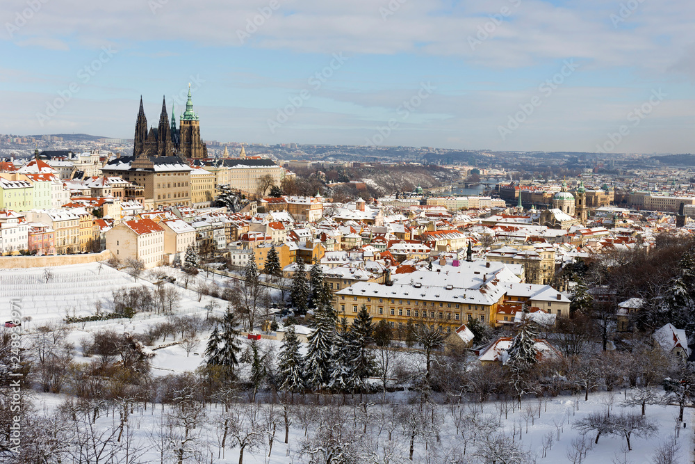 Snowy Prague City with gothic Castle from Hill Petrin in the sunny Day, Czech republic