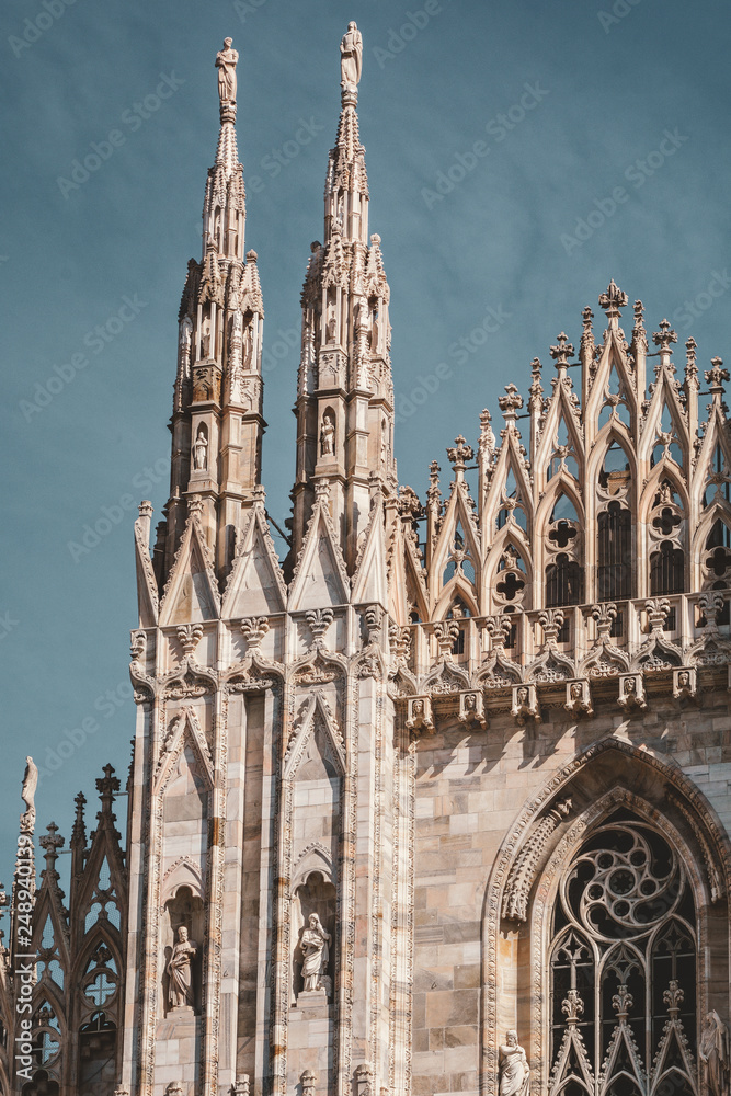 Vintage looking Duomo di Milano meaning Milan Cathedral in Italy, with dramatical sky