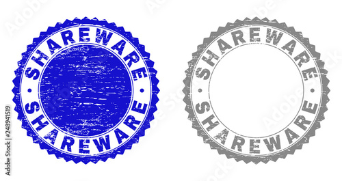 Grunge SHAREWARE stamp seals isolated on a white background. Rosette seals with grunge texture in blue and grey colors. Vector rubber stamp imitation of SHAREWARE text inside round rosette.