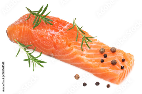 Red fish. Raw salmon fillet with rosemary isolate on white background.