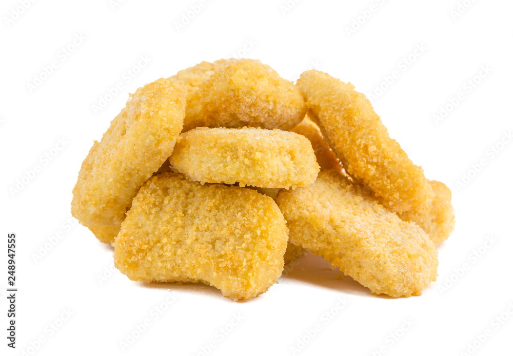 Frozen nuggets on a white background. Several chicken nuggets in breading close-up on a white background. Frozen nuggets on a white background. Several chicken nuggets in breading close-up on a white background.