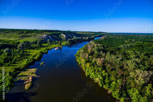 river flowing in the beautiful valley. Aerial view landscape. shooting from a drone. Summer time