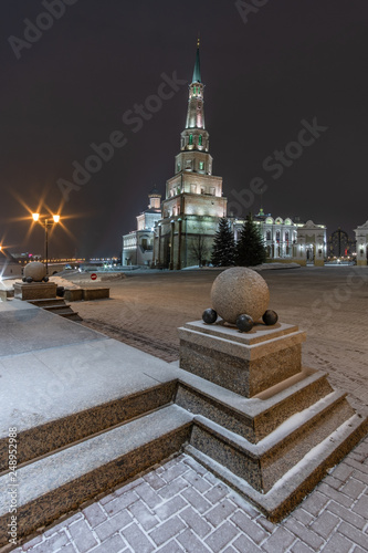 In the old Kremlin in the winter evening in the snowfall. Syuyumbike Tower in the Kazan Kremlin photo