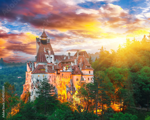 Slika na platnu Landscape with medieval Bran castle known for the myth of Dracula at sunset