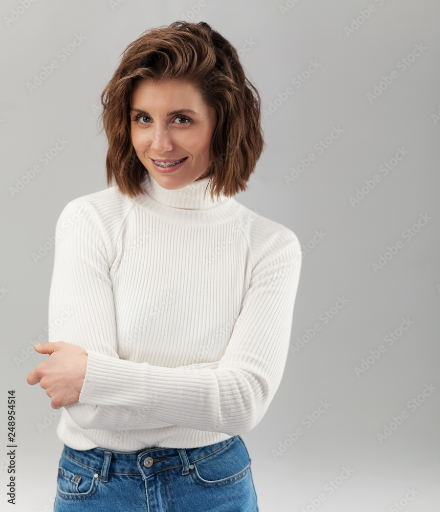 Young beautiful smiley woman with braces
