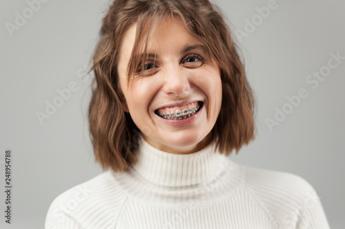 Young beautiful woman with braces