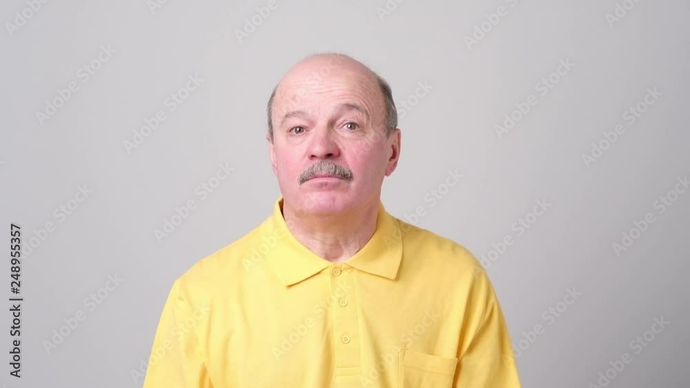 Senior man looking aroung as he is lost Senior man looking aroung as he is lost