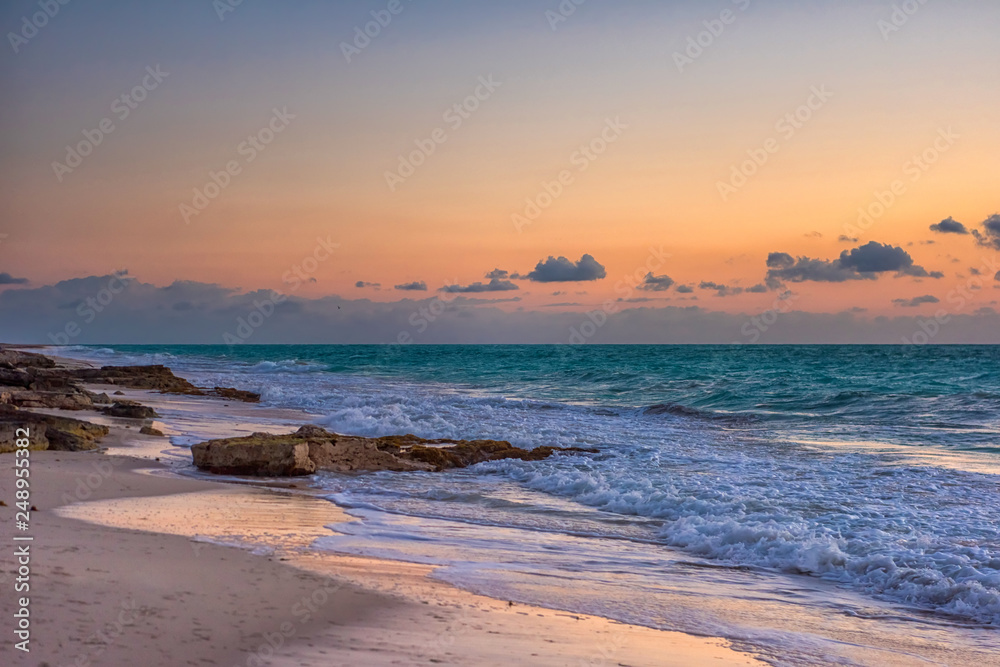 Sunset on the Caribbean Sea. Clear sky with small clouds. Sunset on the Caribbean Sea. Clear sky with small clouds.