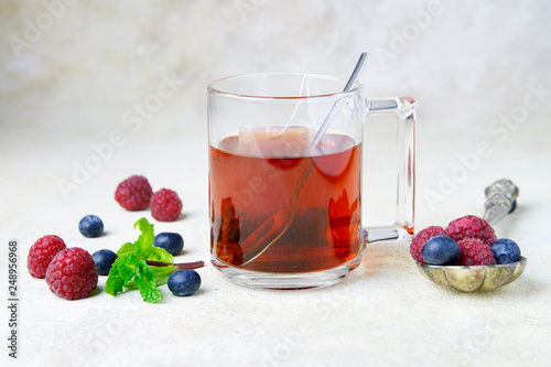 Cup of tea with berry