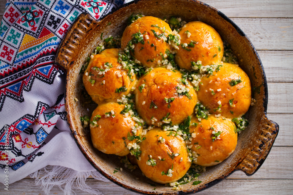 Garlic bread, buns. Bread rolls with garlic and parsley. overhead, horizontal Garlic bread, buns. Bread rolls with garlic and parsley. overhead, horizontal