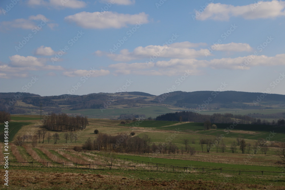 View of Rudawy Janowickie Mountains during spring. Beutiful, warm, sunny, calm, pleasant day. Fresh, green vegetation, grass, leaves, meadow. Sudety, Dolny Śląsk, Lower Silesia, Polska, Polen, Poland View of Rudawy Janowickie Mountains during spring. Beutiful, warm, sunny, calm, pleasant day. Fresh, green vegetation, grass, leaves, meadow. Sudety, Dolny Śląsk, Lower Silesia, Polska, Polen, Poland