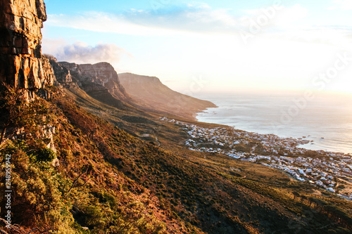 Stunning view of the dramatic landscape of the 12 apostles at sunset, seen from Kloof Corner lookout point on Table Mountain in Cape Town, South Africa