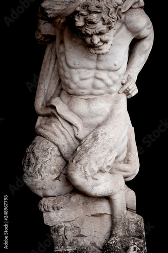 Antique statue of Pan (Faunus in Roman mythology). God of the wild, nature and rustic music. He has the hindquarters, legs, and horns of a goat.