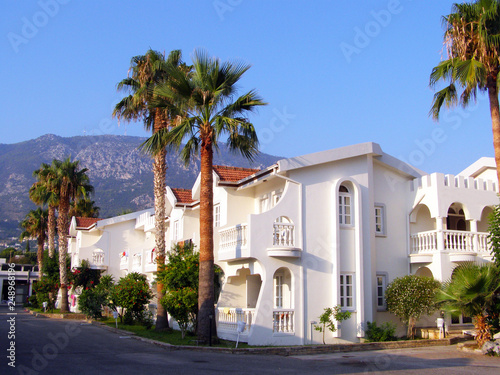 View of the hotel on a sunny day on the Mediterranean coast photo