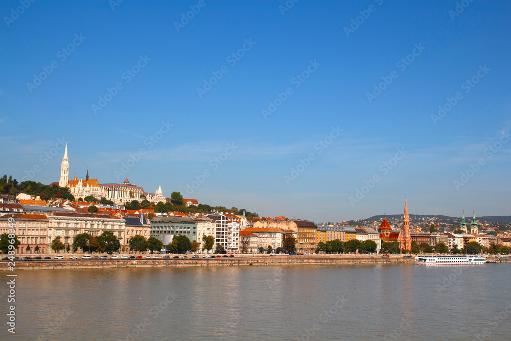 Panoramic view to Danube river in the center of Budapest and beautiful colorful houses along the promenade.