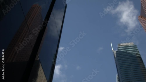 a pan looking up at several downtown towers. photo