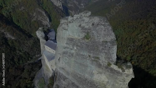 spectacular old castle built into the rocks in the Italian countryside near Genova. photo