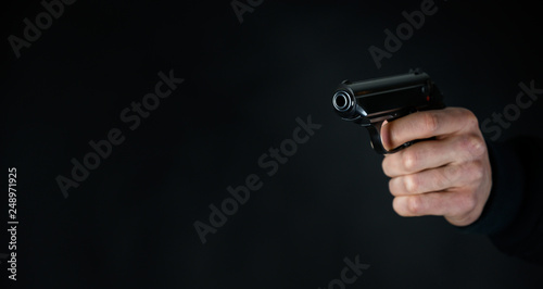 Man with a pistol in the hand