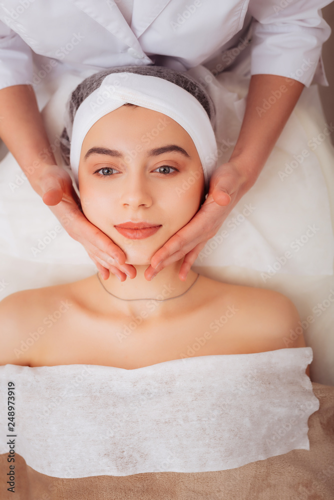 Top view of a nice good looking woman during massage Top view of a nice good looking woman during massage