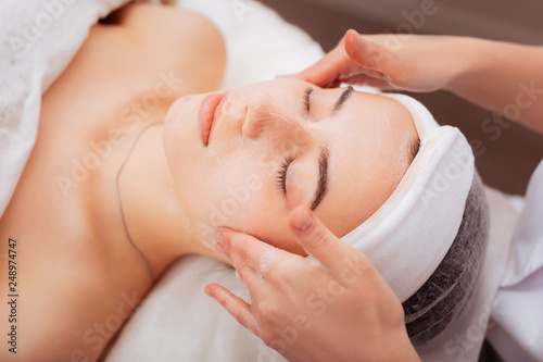 Top view of a nice relaxed woman with closed eyes