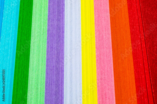 Colored paper on a white background, rainbow colors.