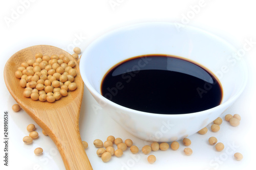 Soya beans with dark soy sauce in a ceramic bowl isolated over white background. Copy Space