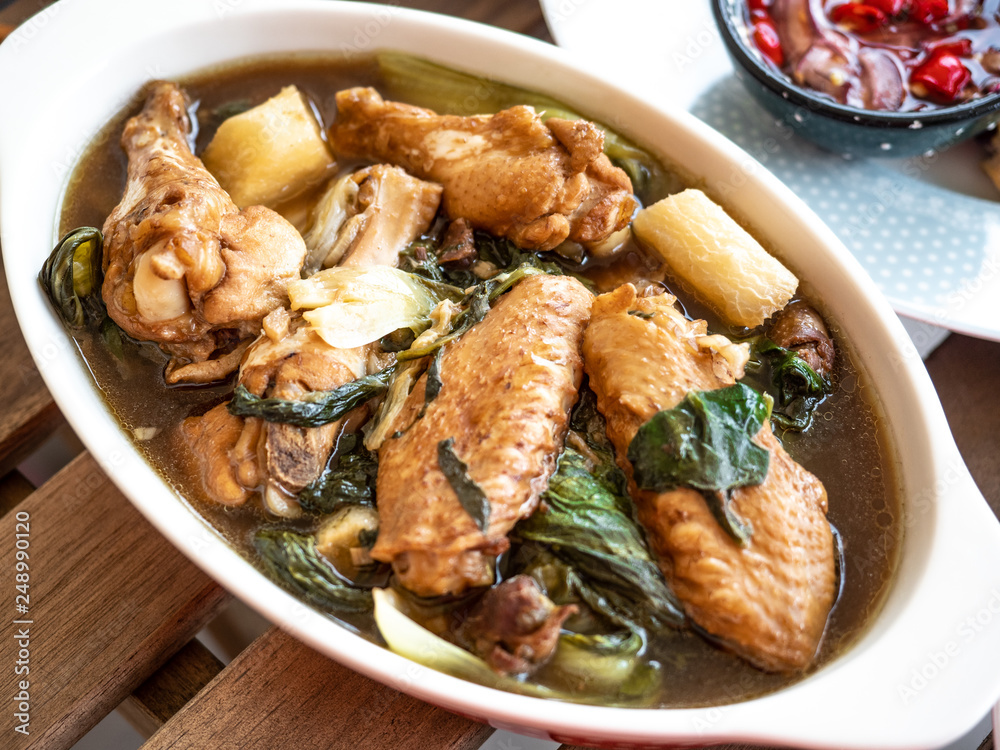 Tom Jab Chai stew in Chinese, Mixed of vegetables soup, tofu, Thai famous cuisine with chicken wings. Tom Jab Chai stew in Chinese, Mixed of vegetables soup, tofu, Thai famous cuisine with chicken wings.