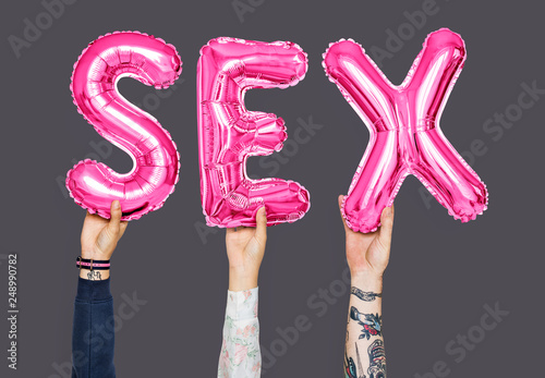 Hands holding sex word in balloon letters