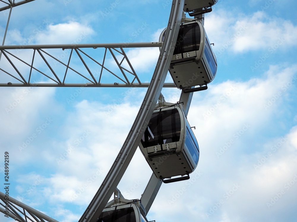 Close up Ferris wheel blue sky joy clouds amusement park, Gdansk, Poland. Close up Ferris wheel blue sky joy clouds amusement park, Gdansk, Poland.