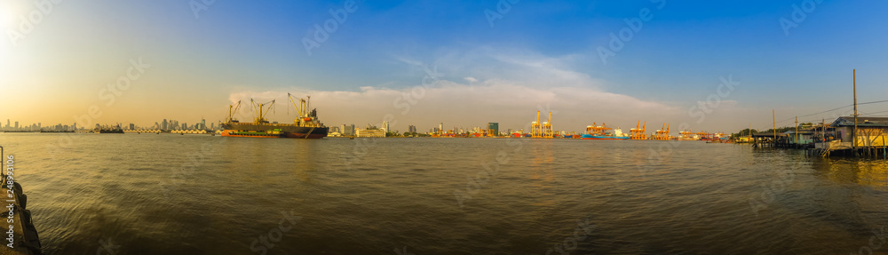 View of Bangkok Port Authority of Thailand or Klong Toey port along Chao Phraya river in Bangkok,Thailand. Heavy crane tool in ship port and container yard use for import and export.